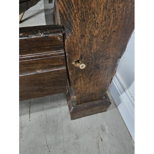 387 - A 17th century and later oak Four Poster Bed  with panelled headboard flanked by leafage carved pila... 