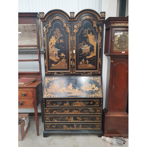 419 - A black lacquered and chinoiserie designed Bureau Bookcase having designs of figures and warriors in... 