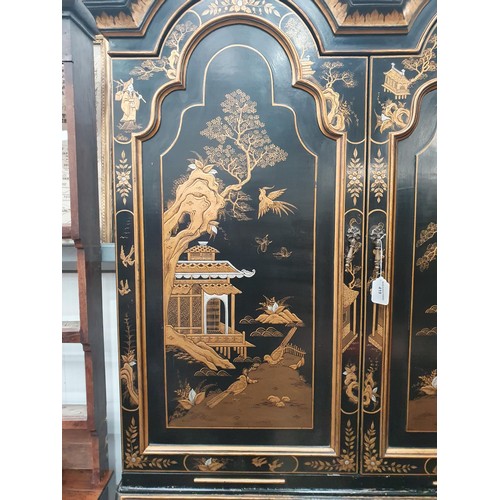 419 - A black lacquered and chinoiserie designed Bureau Bookcase having designs of figures and warriors in... 