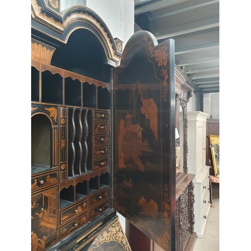 419 - A black lacquered and chinoiserie designed Bureau Bookcase having designs of figures and warriors in... 