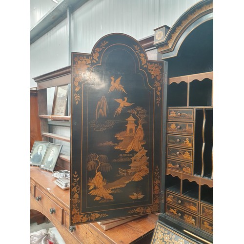 419 - A black lacquered and chinoiserie designed Bureau Bookcase having designs of figures and warriors in... 