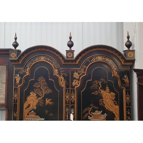 419 - A black lacquered and chinoiserie designed Bureau Bookcase having designs of figures and warriors in... 