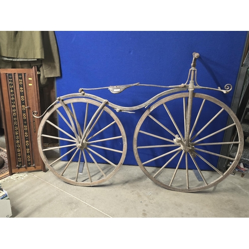 300 - A French Boneshaker Bicycle with turned wooden Handlebars, iron saddle and framework, wooden spoked ... 