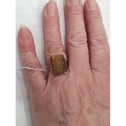 145 - A Victorian Carved Tiger's Eye Cameo Ring, rub-over set tiger's eye plaque carved with a woman in pr... 