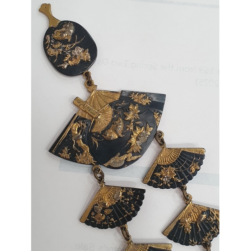 169 - A vintage Damascene Japanese Fan Necklace with fan shaped links and central oval fan drop in gold in... 