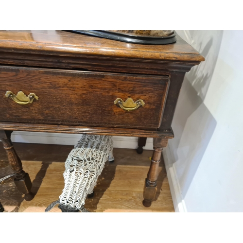 326 - An 18th century oak Dresser Base fitted with three frieze drawers and raised on six turned and squar... 