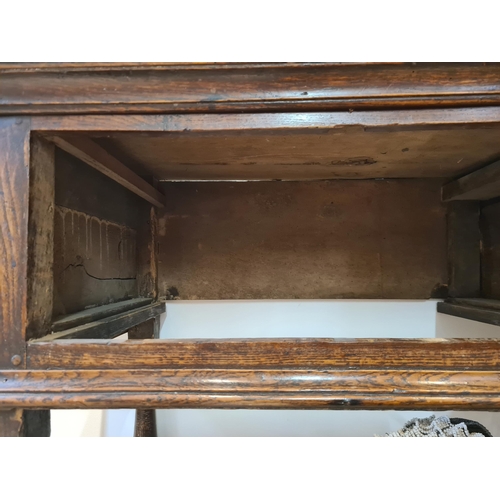 326 - An 18th century oak Dresser Base fitted with three frieze drawers and raised on six turned and squar... 