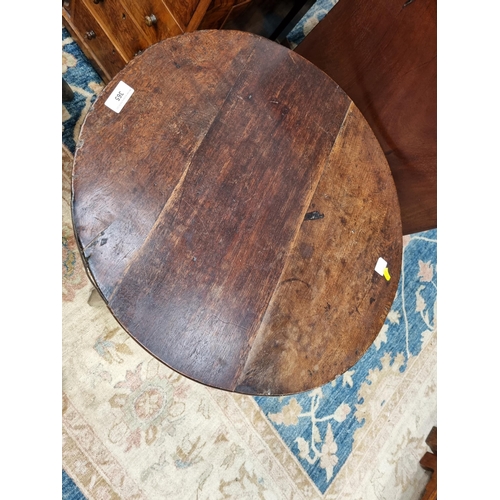 365 - An 18th Century oak Cricket Table with circular top on three triangular supports united by stretcher... 