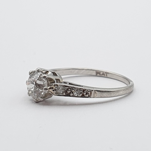 142 - A Diamond Ring, claw-set old-cut diamond in a rex collet with split tapered shoulders set small diam... 