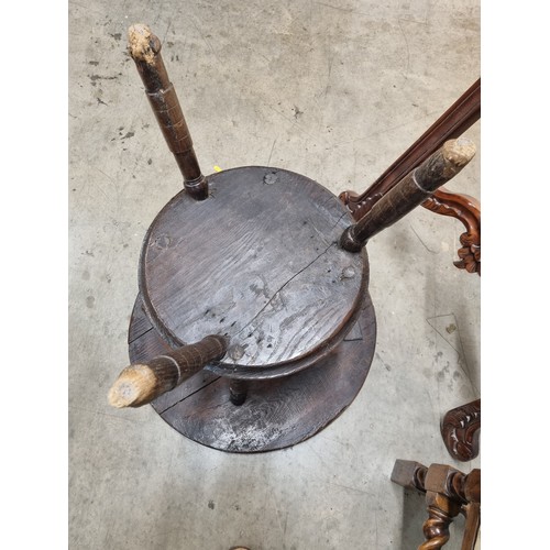 324 - A 19th Century oak Cricket Table, the circular top above turned column and an undertier, raised on t... 