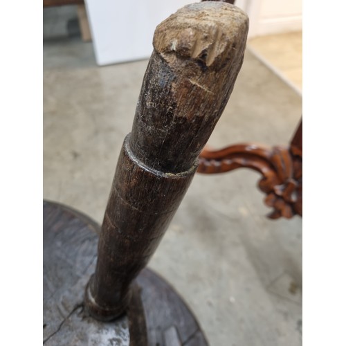 324 - A 19th Century oak Cricket Table, the circular top above turned column and an undertier, raised on t... 