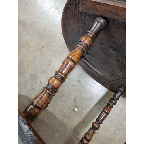 324 - A 19th Century oak Cricket Table, the circular top above turned column and an undertier, raised on t... 