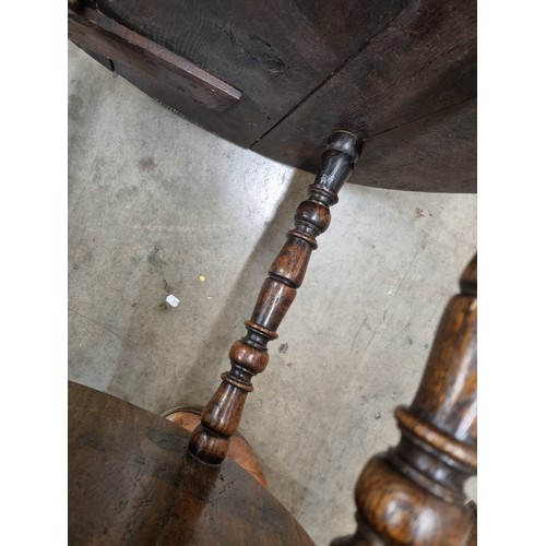 324 - A 19th Century oak Cricket Table, the circular top above turned column and an undertier, raised on t... 