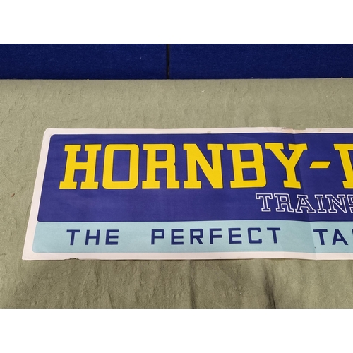 1015 - A Hornby Dublo Shop Display Banner, 39in L x 11in H, generally Ex, has been folded down the middle, ... 