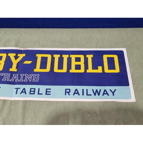 1015 - A Hornby Dublo Shop Display Banner, 39in L x 11in H, generally Ex, has been folded down the middle, ... 