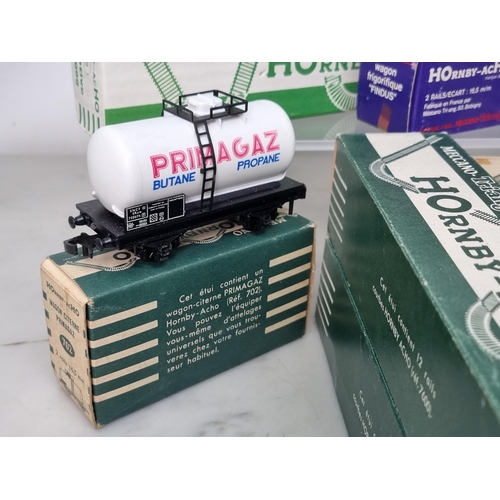 1023 - A boxed Hornby Acho 638 BB 16.000 Electric Locomotive and three boxed Wagons including 702 Primagaz,... 