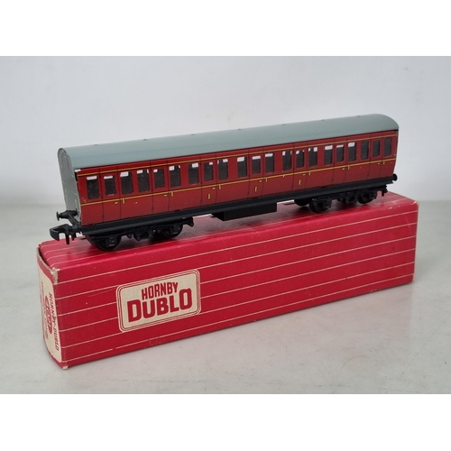 1034 - Two boxed Hornby Dublo 4021 and 4022 BR Suburban Coaches, both with early plastic coupling, both M, ... 