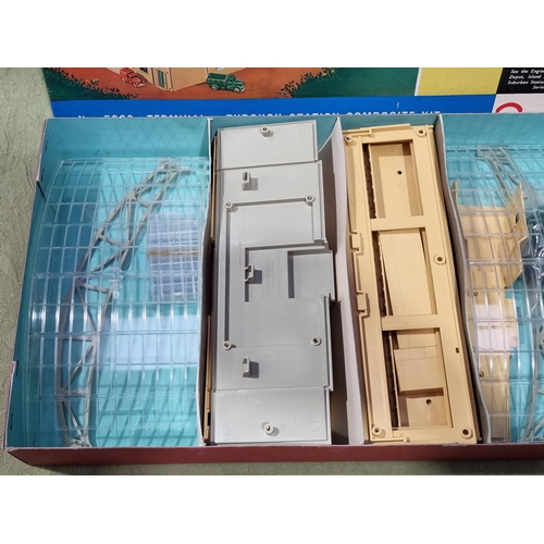 1039 - A boxed Hornby Dublo No.5083 Terminal Station, brand new models, contents in sealed bag, cardboard s... 