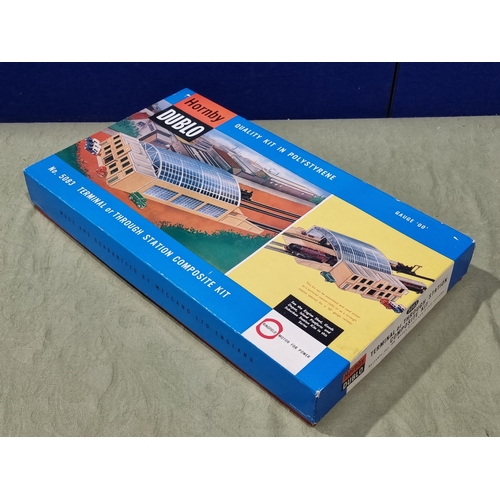 1039 - A boxed Hornby Dublo No.5083 Terminal Station, brand new models, contents in sealed bag, cardboard s... 