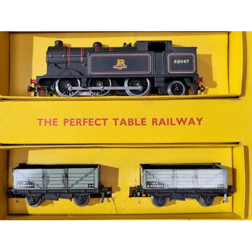 1057 - A boxed Hornby Dublo EDG16 0-6-2 Tank Goods Set, unused showing no signs of use to wheels, armature ... 