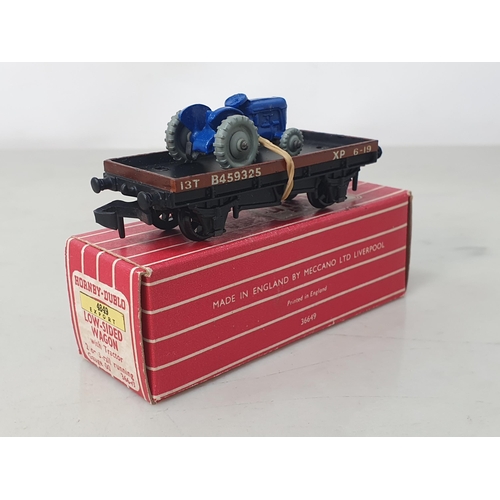 1086 - A reference pair of Hornby Dublo Export 4849 Low-sided Wagons with tractors, one tractor with rarer ... 