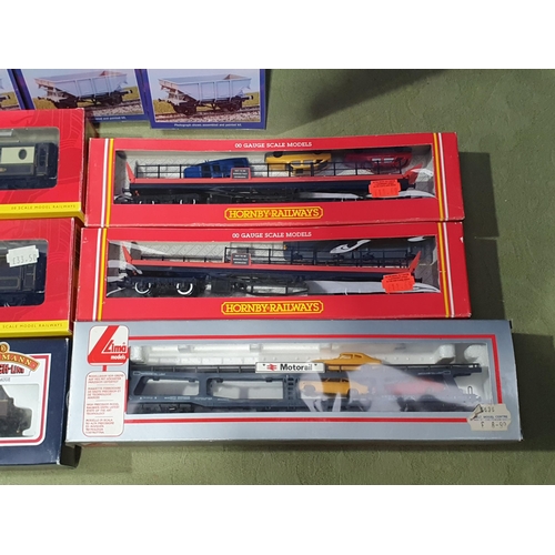 1278 - Two boxed Hornby 00 gauge Car Transporters, two boxed Hornby Pullman Coaches, a boxed Lima Car Trans... 