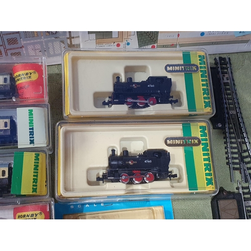 1283 - Two boxed Minitrix 12052 0-6-0T Locomotives, eighteen boxed Coaches and Wagons, four Superquick N sc... 