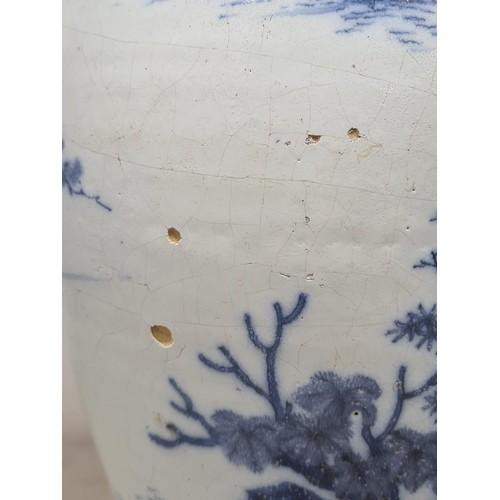 45 - A 17th Century delftware Meiping type Vase, in blue and white glaze, with Oriental landscape with fi... 