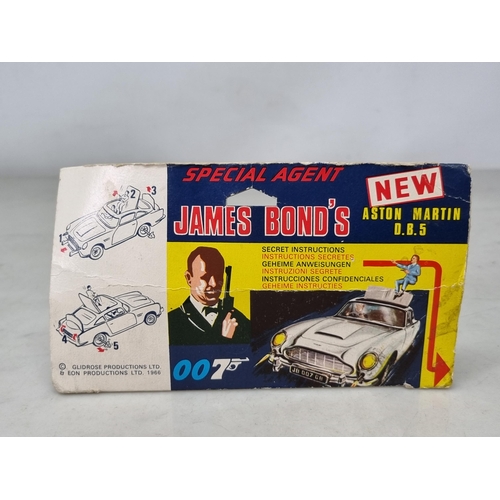 1553 - A boxed Corgi Toys No.270 James Bond Aston Martin DB5 with secret instructions, instructions and sti... 