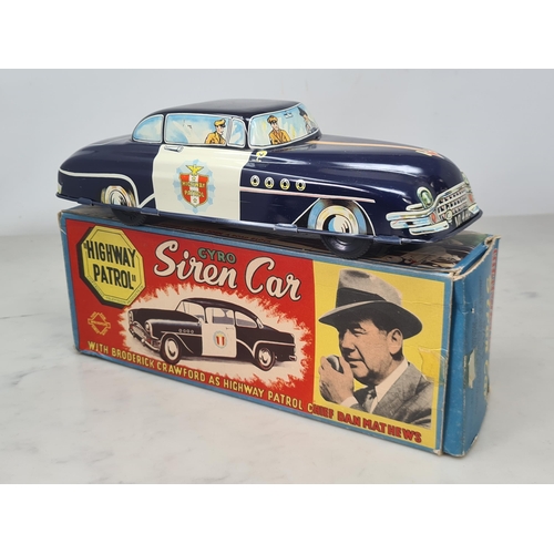 1563 - A boxed Welsotoys Gyro Siren Car 'Highway Patrol', VG-Ex, box VG