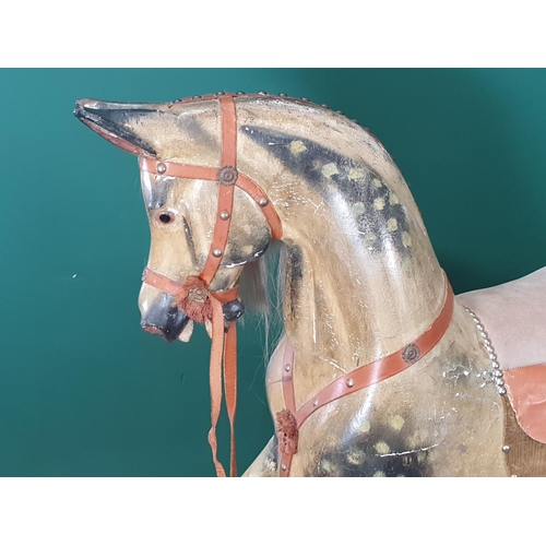 49 - A Victorian carved and painted dapple gray Rocking Horse in the manner of F.H. Ayres, with leather b... 