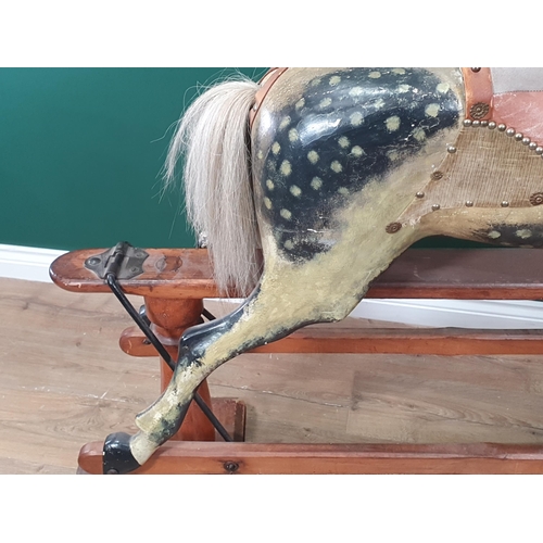49 - A Victorian carved and painted dapple gray Rocking Horse in the manner of F.H. Ayres, with leather b... 