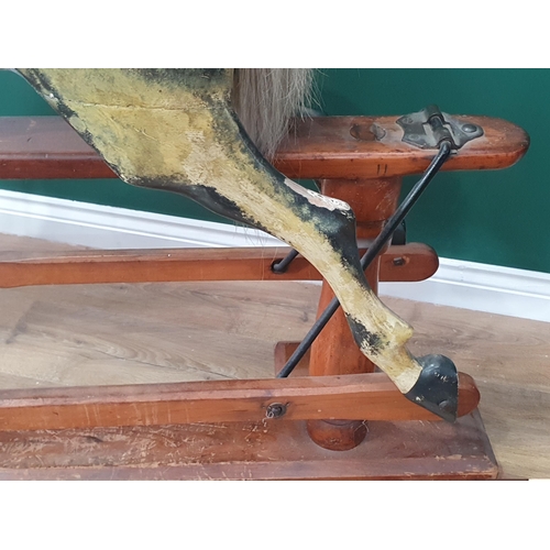 49 - A Victorian carved and painted dapple gray Rocking Horse in the manner of F.H. Ayres, with leather b... 