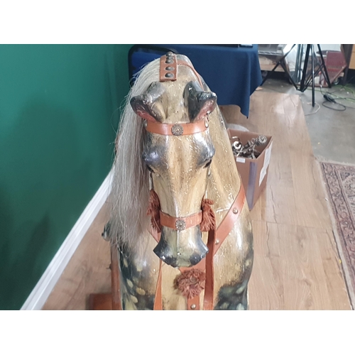49 - A Victorian carved and painted dapple gray Rocking Horse in the manner of F.H. Ayres, with leather b... 