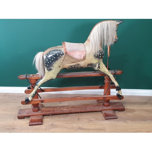 49 - A Victorian carved and painted dapple gray Rocking Horse in the manner of F.H. Ayres, with leather b... 