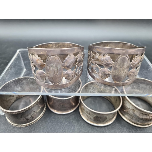 102 - A pair of Edward VII silver Napkin Rings with pierced floral design and initials, Birmingham circa 1... 