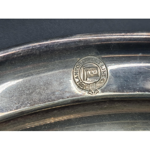 103 - A plated Spoon Warmer in the form of a nautilus shell, a Brandy Saucepan, two Coasters, Sauce Boat, ... 