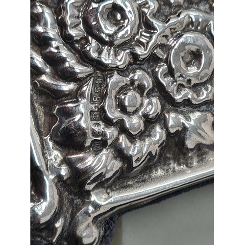 107 - A modern silver Photograph Frame with floral and scroll embossing, vacant cartouche, Birmingham 1996... 