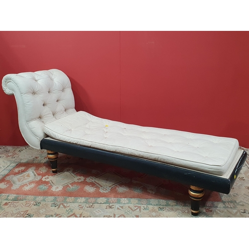 18 - A cream button upholstered miniature Chaise Longue/Day Bed, the painted frame with gilt floral and s... 