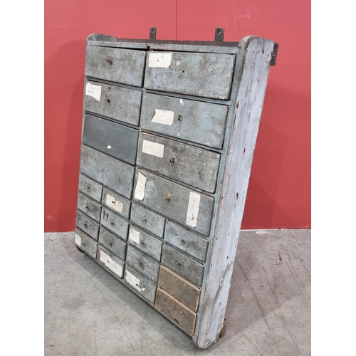 21 - A bank of Twenty Four painted pine wall mounted Workshop Drawers, 32in High x 26in Wide x 5.5in Deep... 