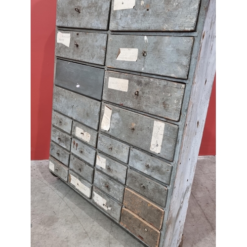21 - A bank of Twenty Four painted pine wall mounted Workshop Drawers, 32in High x 26in Wide x 5.5in Deep... 