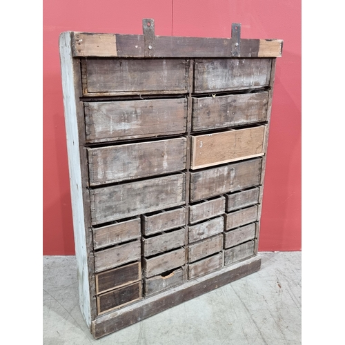 21 - A bank of Twenty Four painted pine wall mounted Workshop Drawers, 32in High x 26in Wide x 5.5in Deep... 