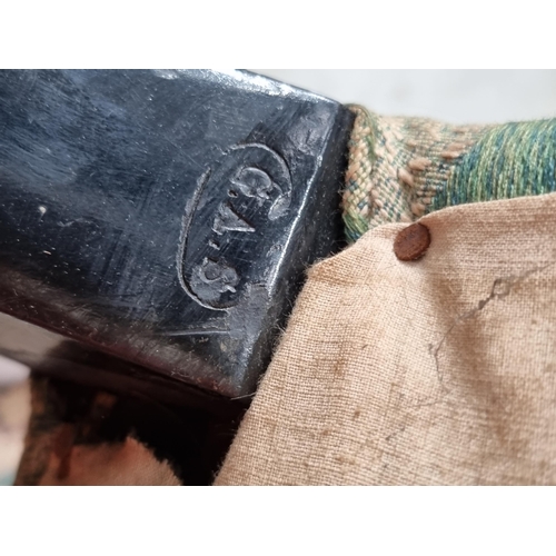 31 - A green and cream upholstered deep seated Armchair with acanthus leaf type decoration, raised on tur... 