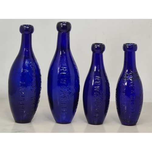 68 - Four flat bottomed blue glass Aerated Water Bottles of torpedo shape by Bradford Bros, etc, Newcastl... 