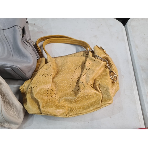 73 - A red leather Handbag by Radley London, and six other leather Handbags by Radley, Demellier, etc (R3... 