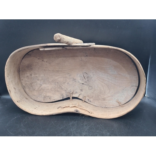 76 - An antique primitive folk art bent oak and elm Seed or Feed Spreader of kidney shape with rustic han... 