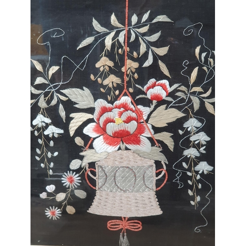 93 - A gilt framed needlework depicting a hanging basket of flowers, 2ft 1in W x 2ft 4in H (R7)