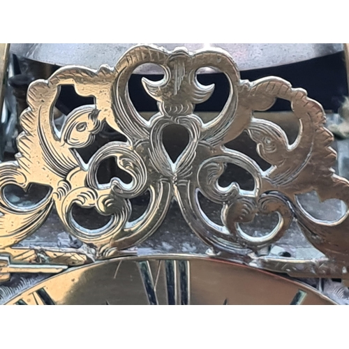 82 - A 17th century style brass cased Lantern Type Clock with circular dial inscribed Will'm Mayhem, Wood... 