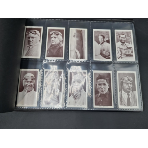 96 - A green Album containing Sets of Cigarette Cards including dogs, birds, historians, paintings, kings... 