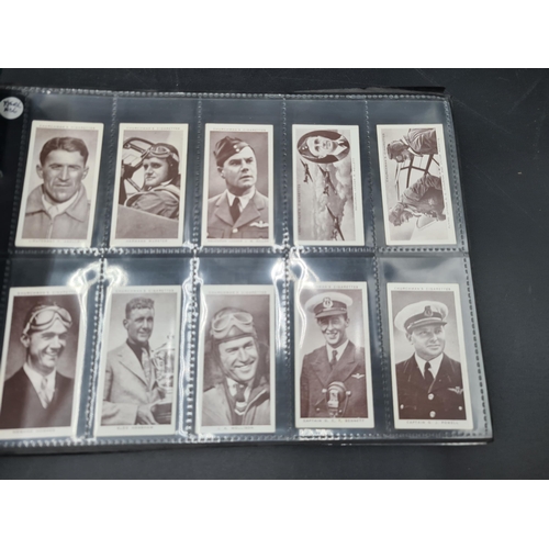 96 - A green Album containing Sets of Cigarette Cards including dogs, birds, historians, paintings, kings... 